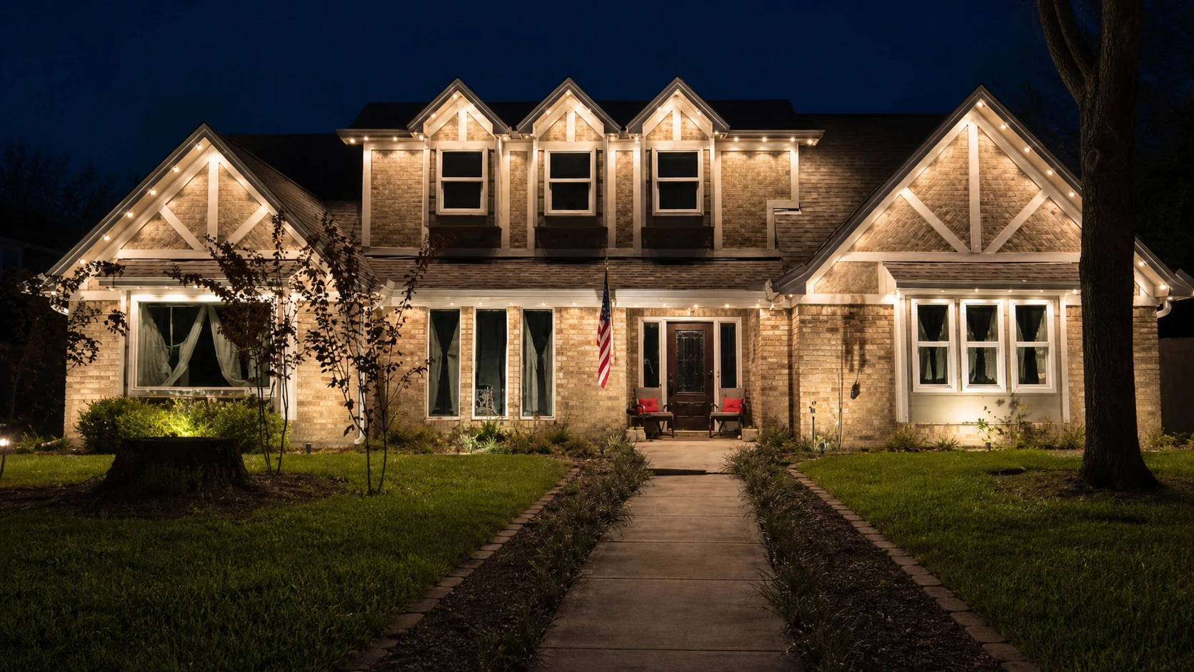 Real BrightSky install — permanent roofline lighting shown in an elegant warm-white color setting at night